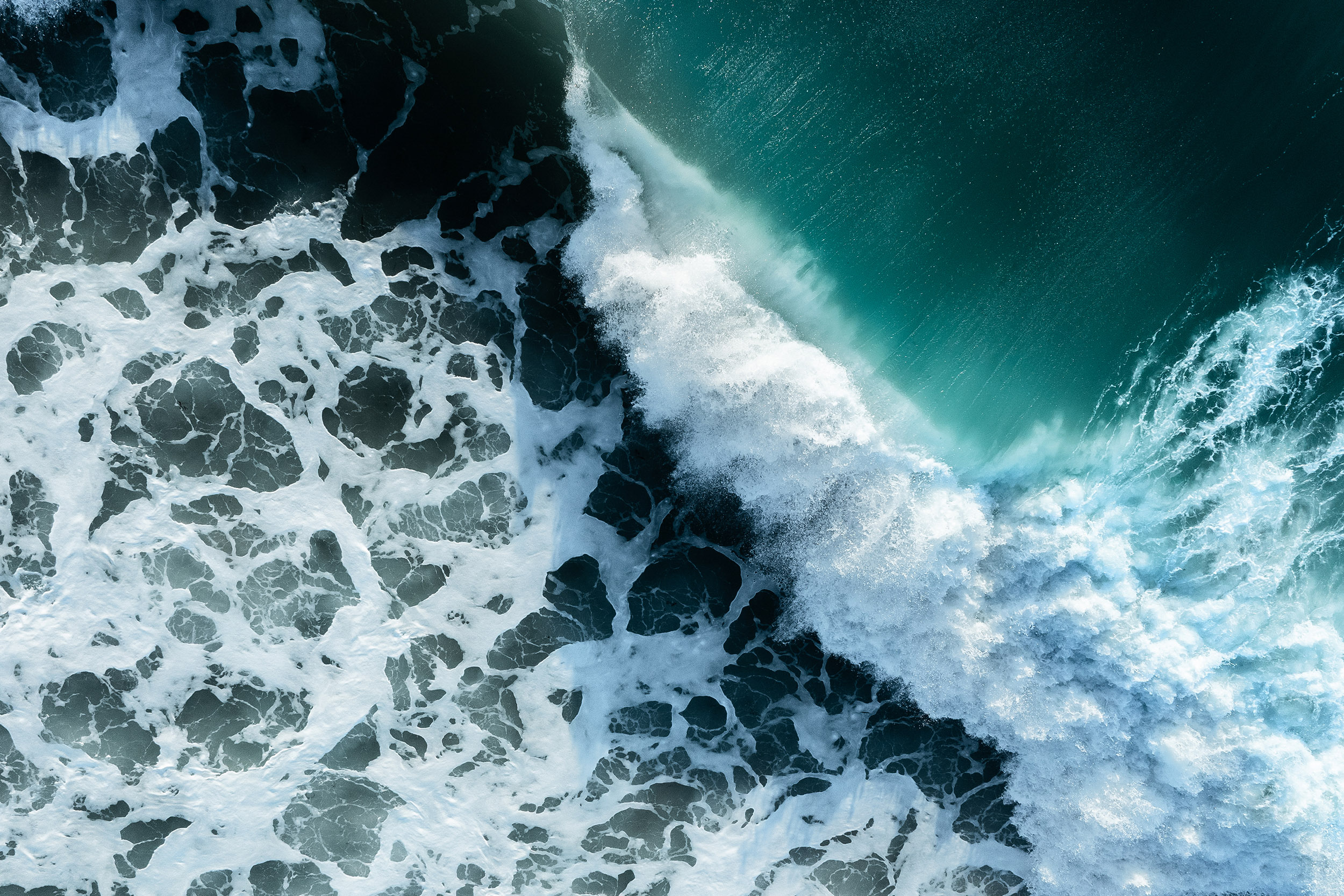 blue sea and white foaming waves